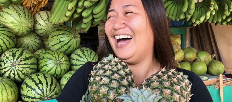 Happy smiling Filipino Filipina Fruit vendor Joy