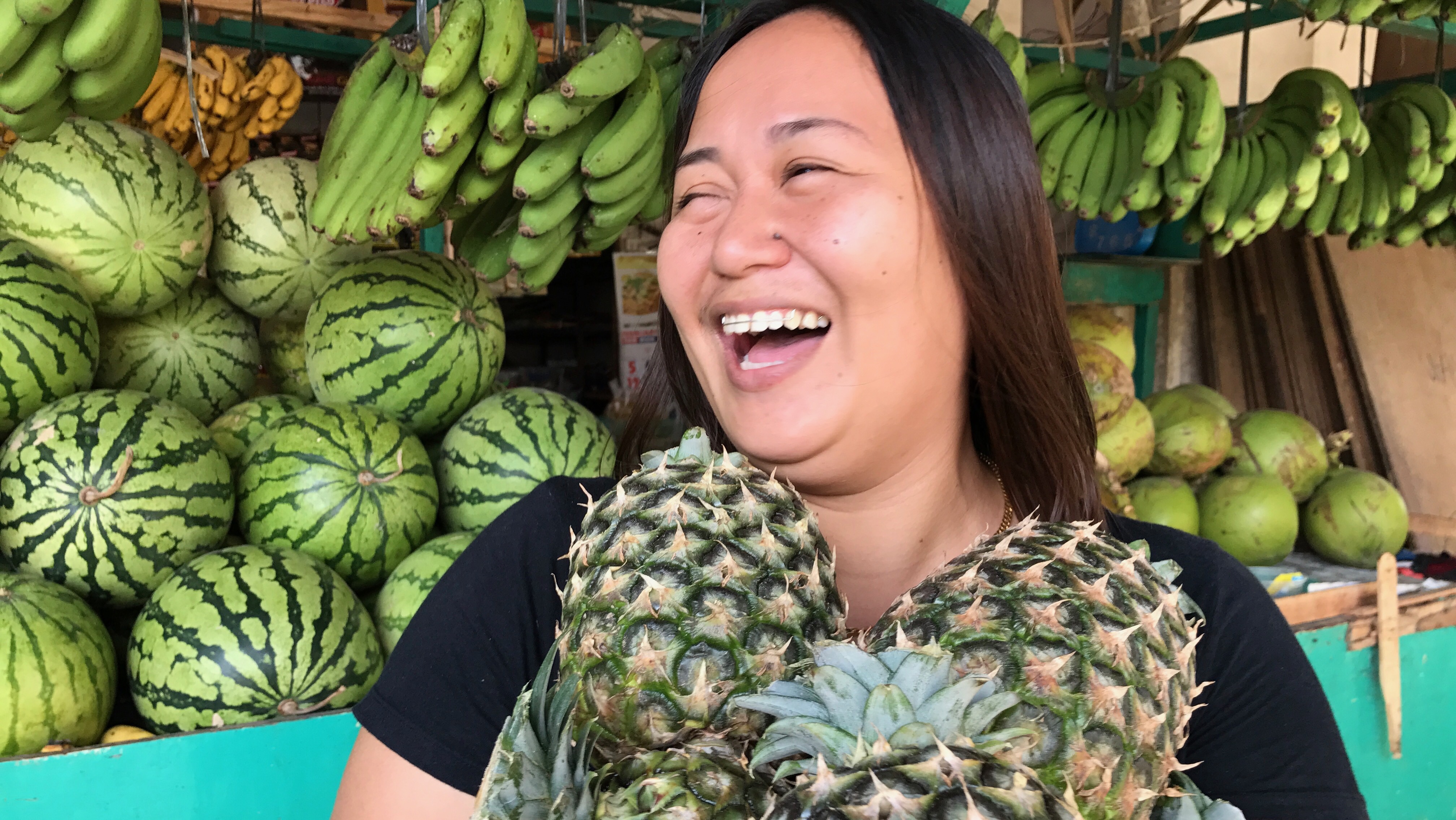 Happy smiling Filipino Filipina Fruit vendor Joy